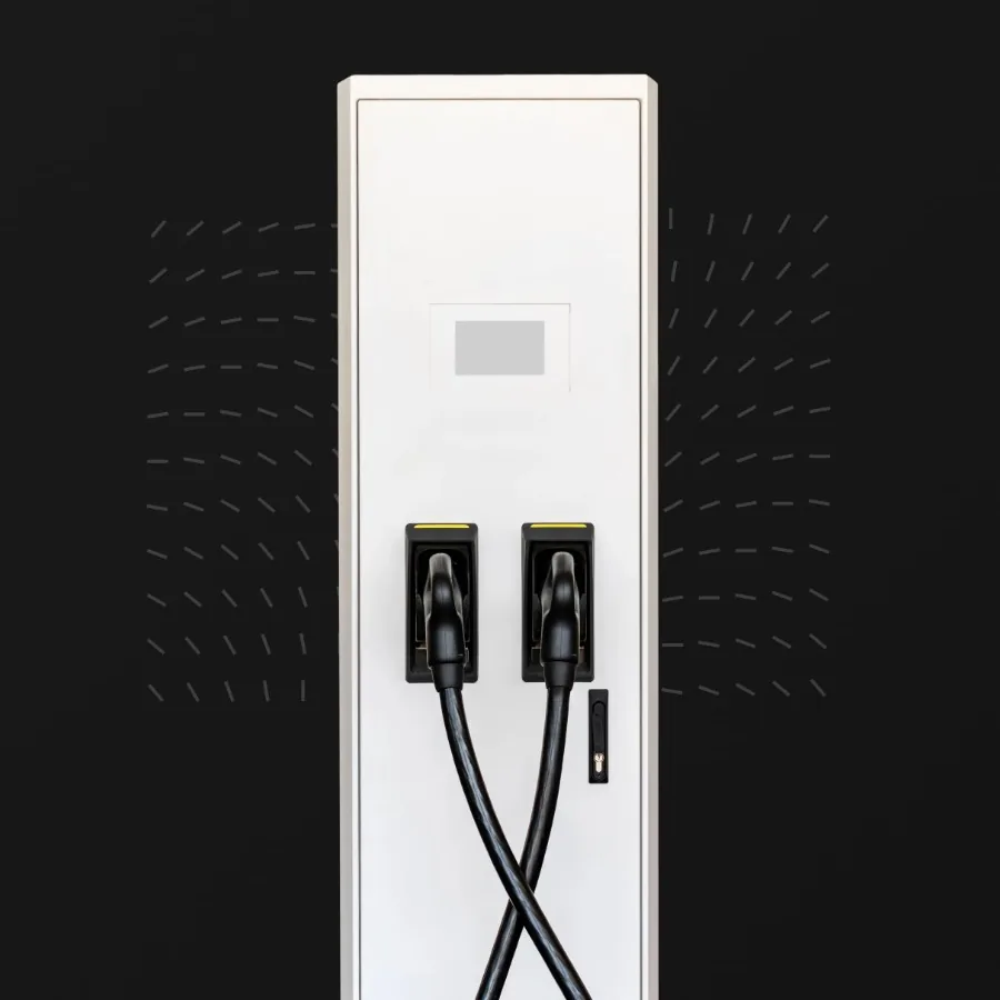 Floor-mounted DC charger: a tall white pillar with two holstered charging connectors
