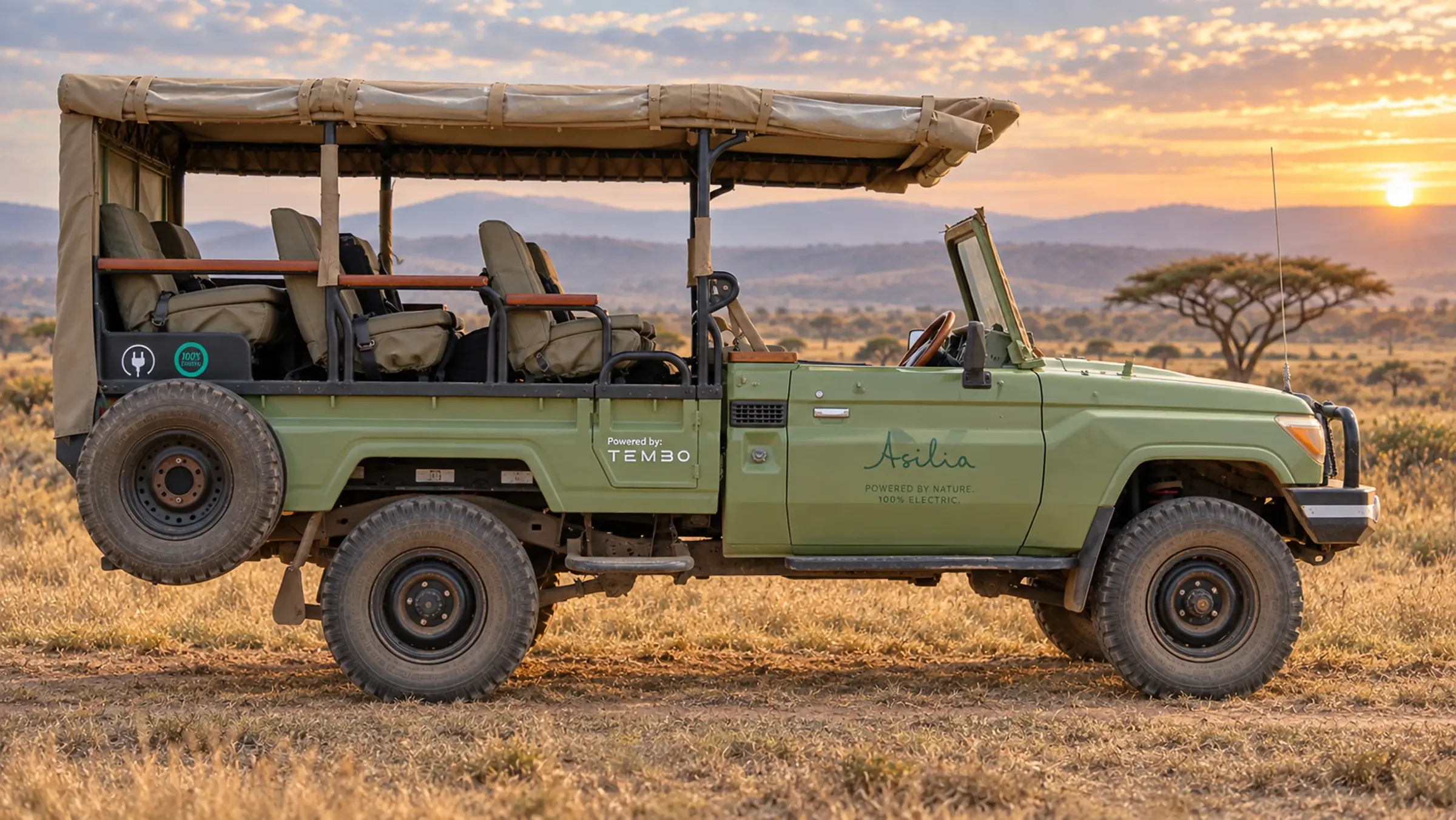 Asilia safari vehicle powered by Tembo at sunset on the savanna