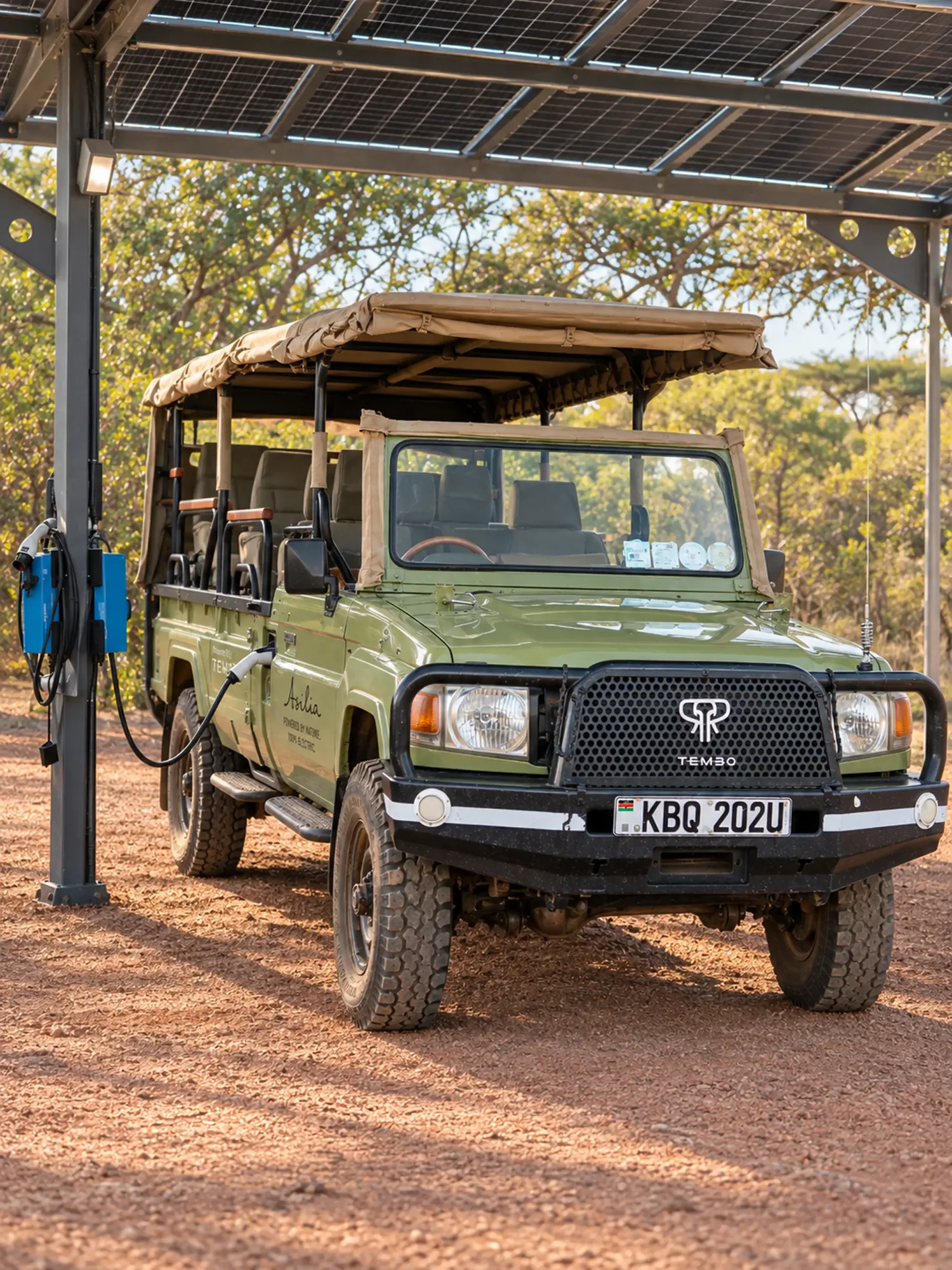 Asilia safari vehicle charging under a solar canopy